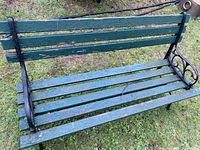 View of the bench from front showing the seat slats and armrest design.