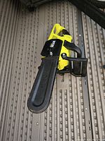 Top-down view of chainsaw with protective cover on