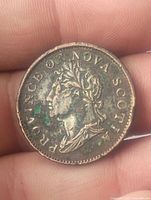 Front side of the 1824 Nova Scotia Half Penny Token showing a profile portrait with surrounding text 'PROVINCE OF NOVA SCOTIA'.