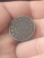 Reverse side of the 1884 Canada Large Cent showing denomination, date, and wreath design.