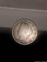 Front side of 1912 US Barber Nickel showing Barber head design and year 1912