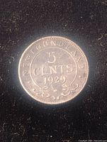 Front side of the 1929 Newfoundland 5 cents coin, showing denomination and inscription.