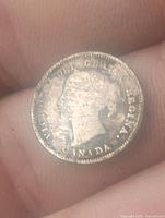 Obverse side of a 1900 Canadian 5 cent silver coin showing Queen Victoria's profile and surrounding inscription.