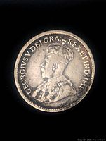 Obverse of the 1913 Canadian silver 5 cent coin showing portrait of King George V with inscription.