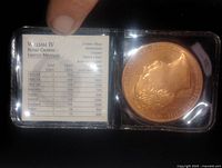 Front side of coin showing King George III profile and certificate of limited mintage details.