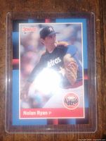 Front image of the baseball card featuring Nolan Ryan in Houston Astros uniform, showing card details and condition.