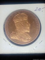 Close-up photo of the obverse of the proof strike coin featuring King Edward's right-facing portrait with detailed crown and ceremonial attire. Coin is encased in a clear holder with markings visible.