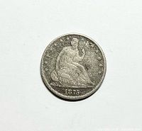 Obverse of the 1875 Seated Liberty silver half dollar showing Liberty seated, date 1875 at bottom with 13 stars around.