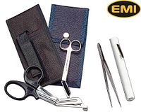 First image shows EMS shears, bandage scissors, splinter forceps, disposable penlight laid out next to two nylon holsters (black and blue) showing contents and design.