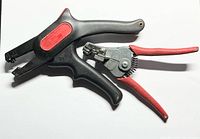 Two wire strippers on white background showing overall appearance and grip style.