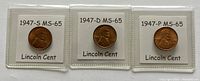 Obverse side of 3 Lincoln Wheat Cents dated 1947 from S, D, P mints in MS-65 condition in protective flips.