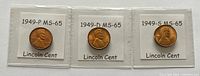 Front side of 3 Lincoln Wheat Cent coins from 1949-P, 1949-D, and 1949-S each graded MS-65 or better shown in individual coin holders with labels.