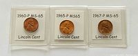 Obverse view of the three Lincoln cents from 1960-P, 1965-P, and 1967-P showing Abraham Lincoln's bust and grade labels.