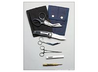 Photo showing EMS shears, bandage scissors, folding knife, straight Kelly forceps, penlight, and window punch, all accessories for the EMS Rescue Holster set.