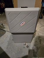 Closed view of Koolatron electric cooler showing the lid design with diagonal lines and logo.