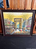 Front view of the signed Paris scene painting showing the entire framed artwork.