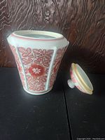 Photo of vintage ginger jar with lid removed, showing exterior design and shape.