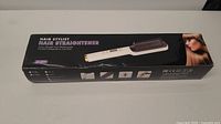 Hair Stylist Hair Straightener in its original black packaging with product image and brand name.