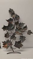 Front view of the metal maple leaf branch art showing the detailed metal leaves and branch structure.