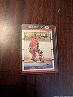 Front view of 1990-91 Score Eric Lindros Rookie Card, showing player in red uniform labeled Rookie Card and Future Superstar