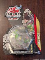 Front view of unopened Bakugan Neo Troxx figure in clear blister pack with Bakugan Evolutions logo and branding.