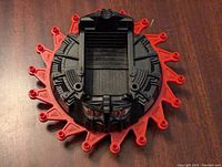 Top view showing the central compartment and face detailing with red claw extensions