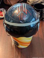 Front top view showing the top of the helmet with 'Maverick' logo and striped design