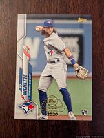 Front image of 2020 Topps Bo Bichette rookie card showing player in full uniform, Topps and rookie logos.