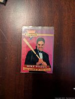 Front side of the Mike Piazza 1993 Rookie of the Year Ultra-Pro card showing image of Mike Piazza in tuxedo holding a baseball bat with Ultra-Pro logo and text at bottom.