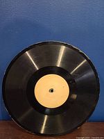 Front view of black 10-inch antique Edison thick record with plain, off-white label and catalog number #50483-3.