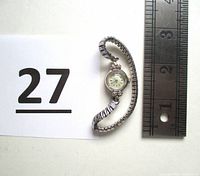 Top view of the Lady Hamilton 14 KT white gold watch with Spiedel USA band and ruler showing size.