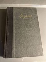 Front cover of the book showing the textured dark gray material with Danielle Steele's embossed signature in gold.