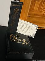 Black hardcover prologue book titled 'The Octonnumi Fosbury' with gold embossed lettering and pronunciation guide.