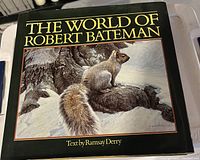 Front cover of 'The World of Robert Bateman' book with an illustration of a squirrel on a rock with snow and trees in the background.