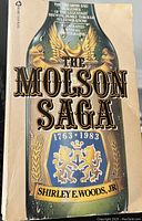 Front cover of 'The Molson Saga' book showing title, subtitle and author.