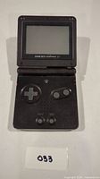 Front view of the Game Boy Advance SP open, showing buttons and screen.