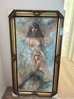 Full view of framed canvas painting showing two nude female figures and ornate frame