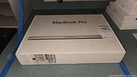 Front of sealed retail box of the 15.4-inch MacBook Pro
