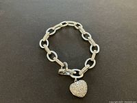 Full view of bracelet on black background showing overall design