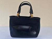 Front view of handbag showing overall design and condition