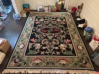 Overhead shot showing entire rug laid out on floor among surrounding furniture