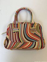 Front view showing full abstract swirl pattern and structured shape