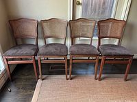 Front view of four chairs in line.
