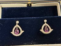 Pair of drop earrings in jewelry box