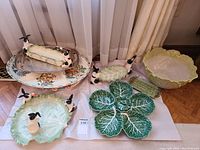 Overview of ten-piece lot: cabbage bowl, relish dishes, asparagus plate, metal tray, salt and pepper shakers and Italian relish tray