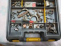 Organizer case showing metal clamps, conduit connectors, outlet box clamps, copper and metal electrical parts