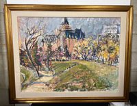 Full view of framed oil painting showing castle scene and gold gilt frame with linen liner