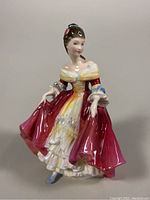 Front angle of Royal Doulton Southern Belle figurine showing detailed dress and face