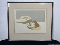 Framed print titled 'Ancient Shore' by Toni Onley showing full artwork in silver-tone frame with beige matting