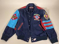 Front view of navy blue bomber jacket with embroidered 'World Champion 92 93 Toronto Blue Jays Back 2 Back' patch and snap closure